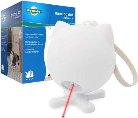 White cat-shaped PetSafe Dancing Dot laser cat toy on a stand projecting a red laser beam, shown next to its box
