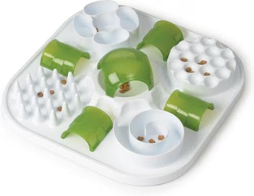 Green and white Catit Play Treat Puzzle cat toy with kibble hidden in its cups, cones and channels