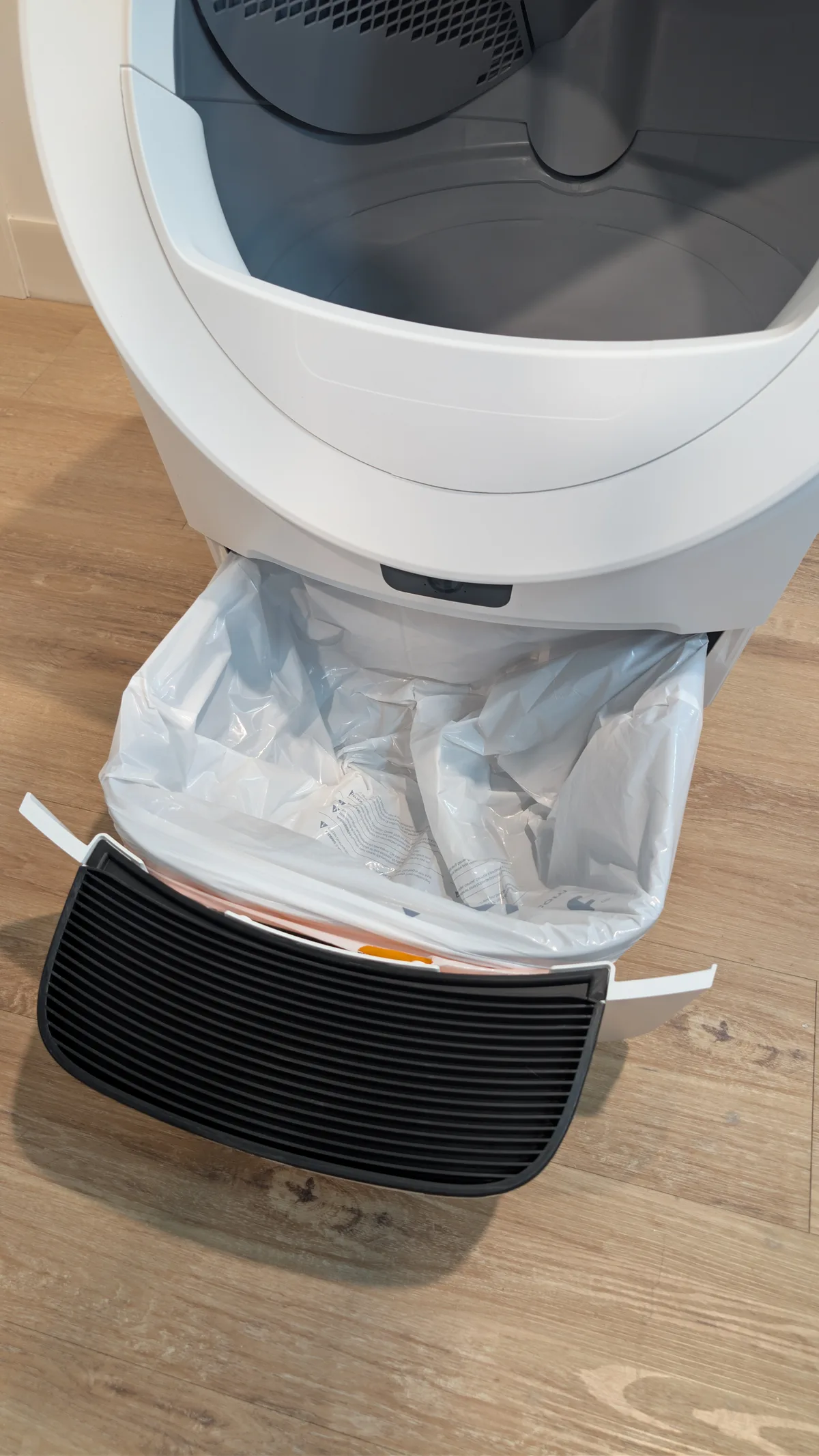 Litter-Robot waste drawer pulled open with a liner installed