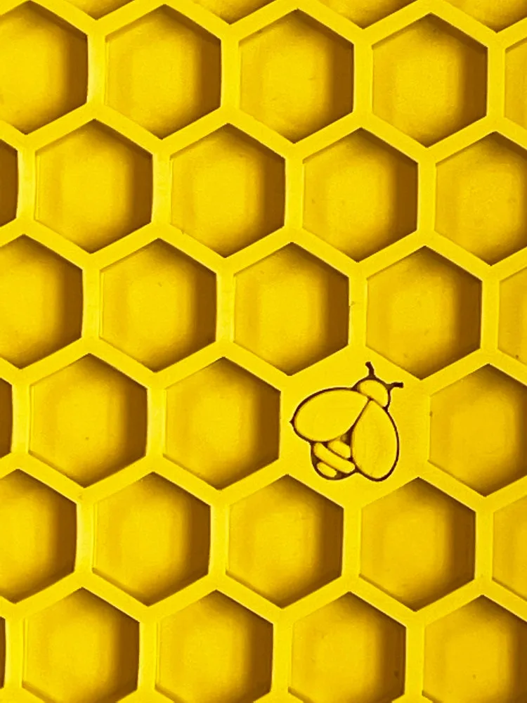 Close view of the raised hexagonal cells in a yellow Honeycomb mat