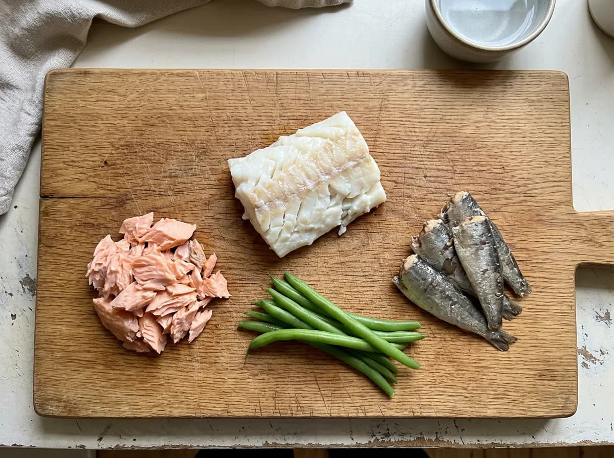 Dog-safe cooked cod, sardines, and salmon showing which fish dogs can eat