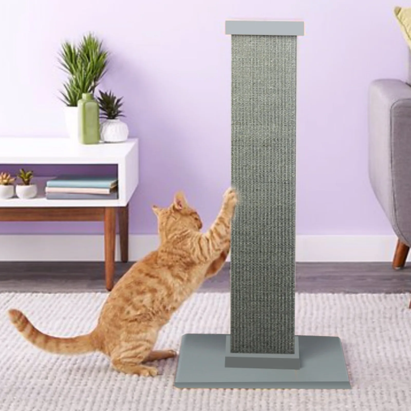 Orange tabby reaching up the gray SmartCat Ultimate scratching post.