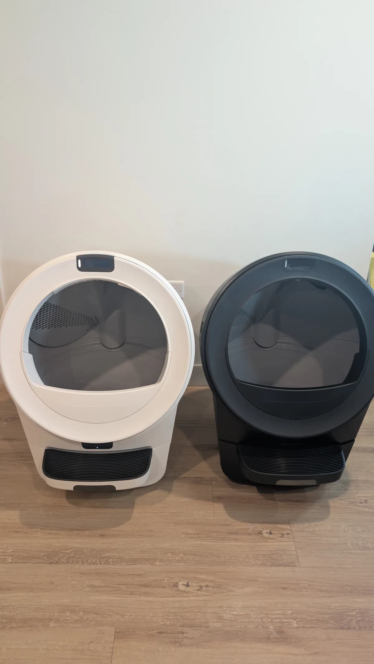 White Litter-Robot 5 Pro next to a black Litter-Robot in the same home