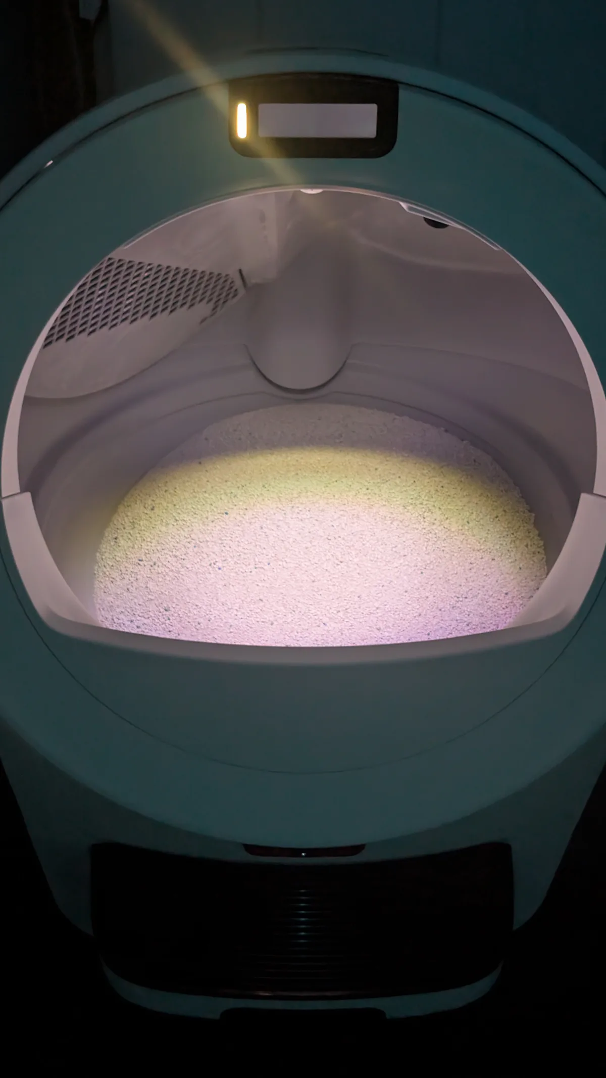 Litter-Robot 5 Pro interior and status display photographed in low light