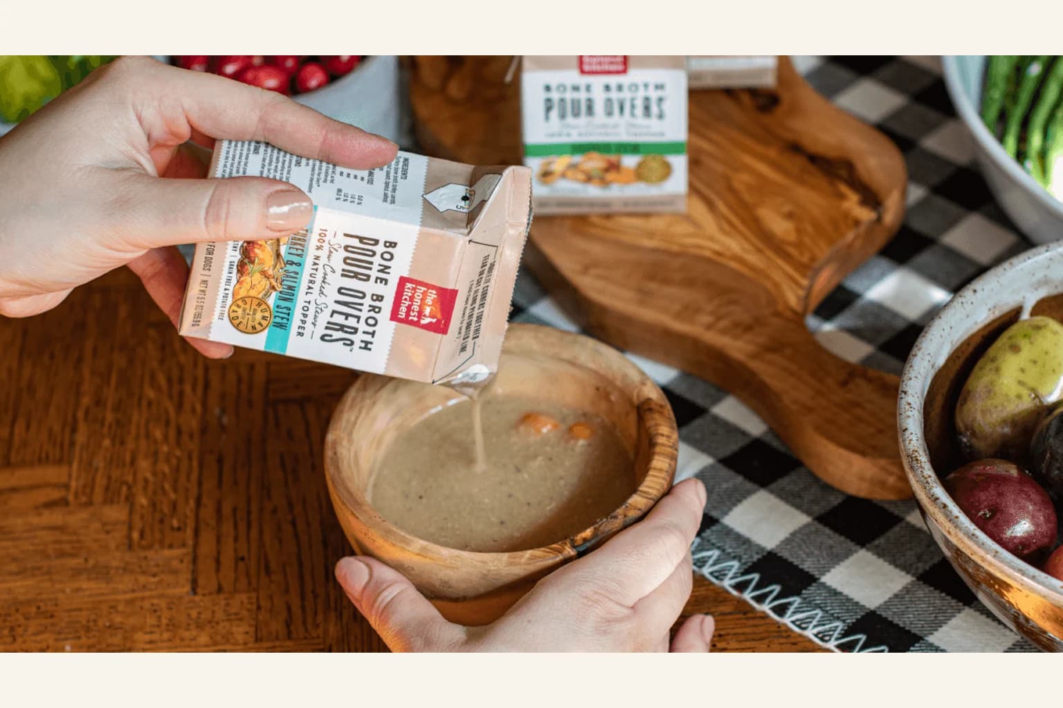The Honest Kitchen Bone Broth Pour Overs being added to a dog meal