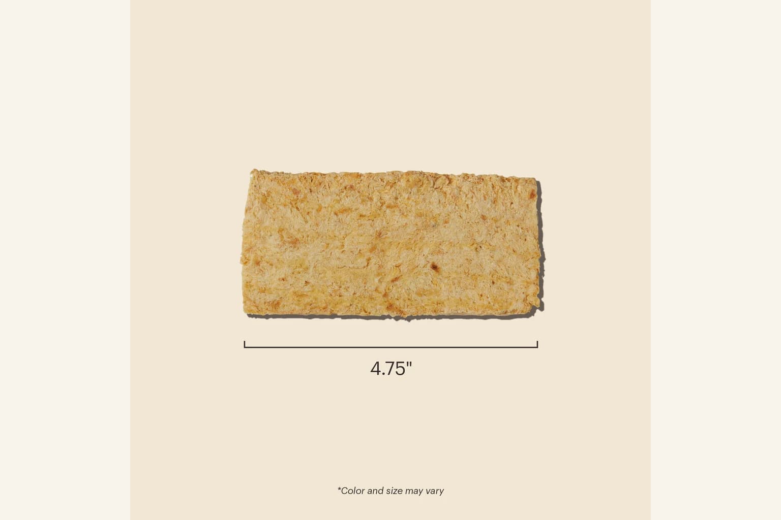 A single whitefish filet dog treat shown to scale