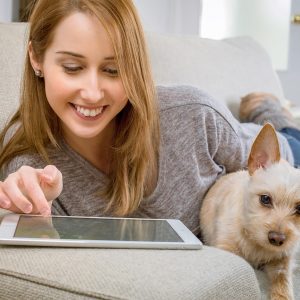 pet costs as woman sits with dog