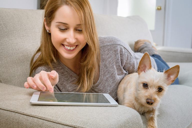 pet costs as woman sits with dog